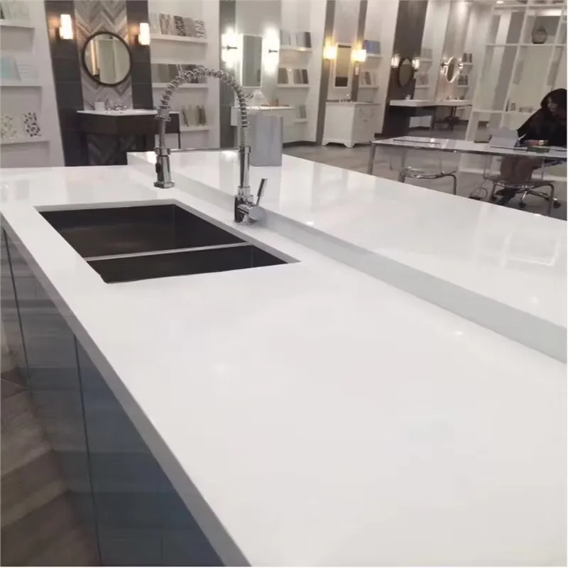 Bright polished white countertop application with sink and spring-neck faucet
